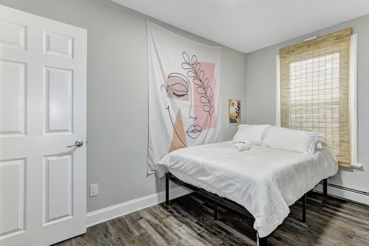 The second bedroom on the main level offers a heavenly sleeping experience with a memory foam mattress and 100% Egyptian cotton sheets and duvet cover.