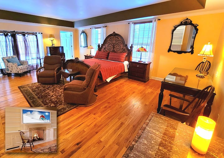 First Floor 24 x 38 foot master bedroom suite has a king bed, a marble fireplace, his and hers walk-in closets, a writing table, and a spacious jacuzzi bathroom.