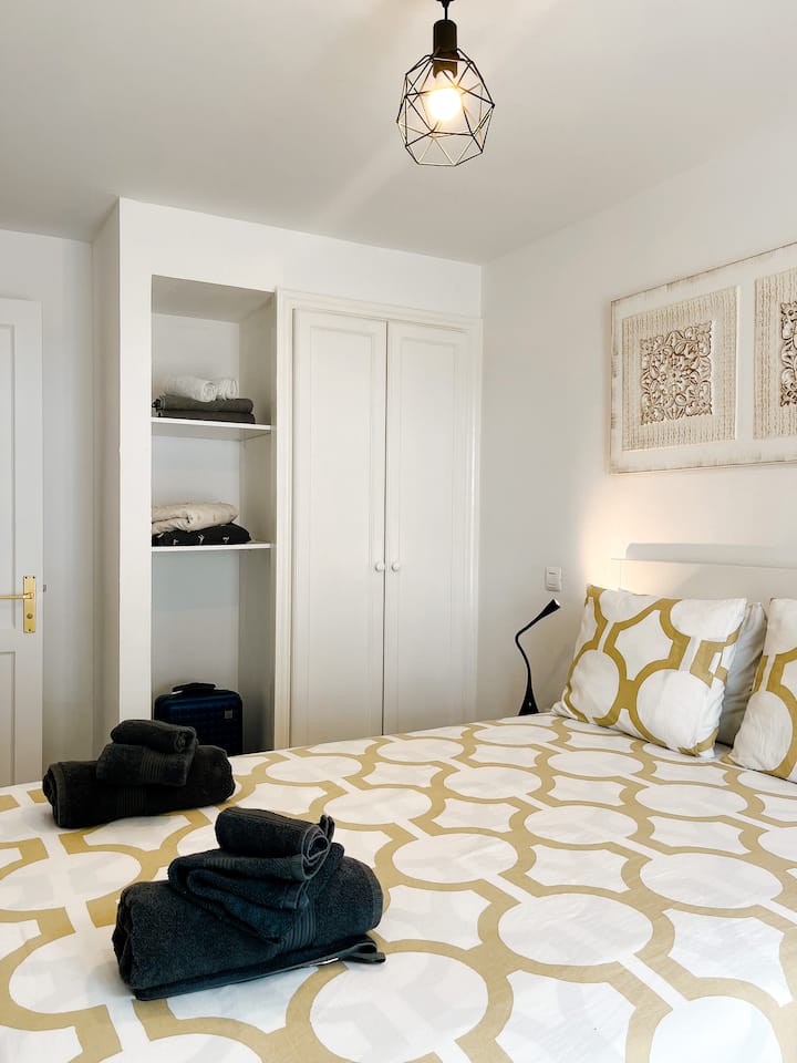 Master bedroom with a French double bed.  Equipped with closet and suitcase holder with shelves. 