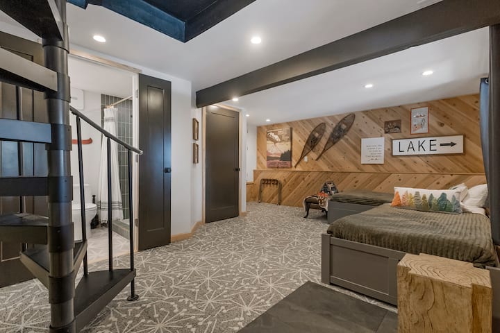 The walkout basement was completely redone in 2022 and features a brand new bathroom, washer/dryer closet, three twin beds, view of the lake and a wallpaper mural.  