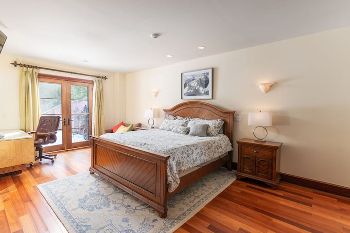 The Lucca: simple country style. This room is on the ground level and has access from the outside. There is a king bed and pull-out sofa chair. 