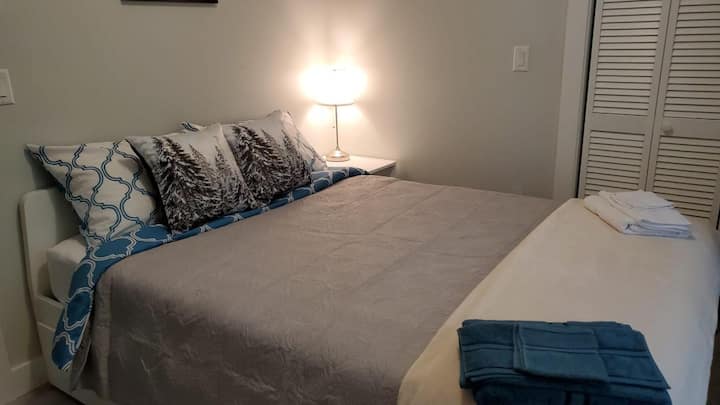 Queen bed in the first bedroom