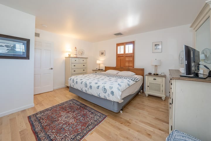 Primary / Master Bedroom with King Size Bed, Master Bathroom, closets and TV