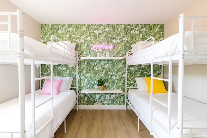 Bedroom 3 features two bunk beds and four twin beds in total. It provides electrical sockets for guests sleeping in the upper beds to charge phones or read books.