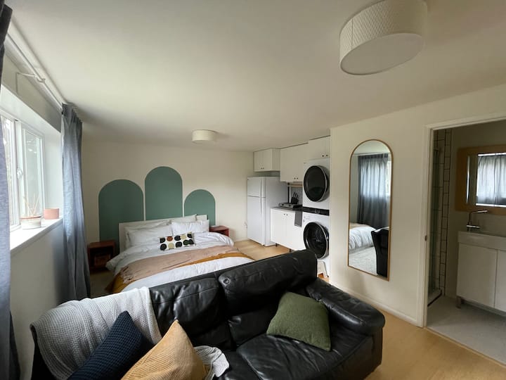 Entire guest suite: bed, couch, kitchenette, bathroom