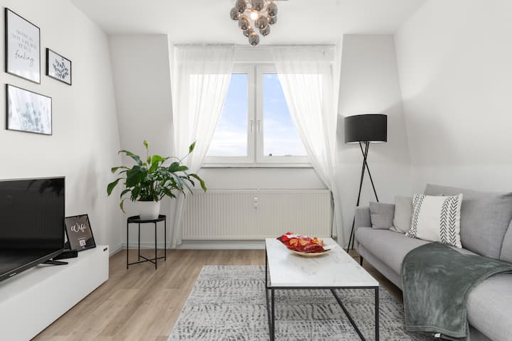 A modern smart TV in a beautiful design living room offers you the most modern entertainment.