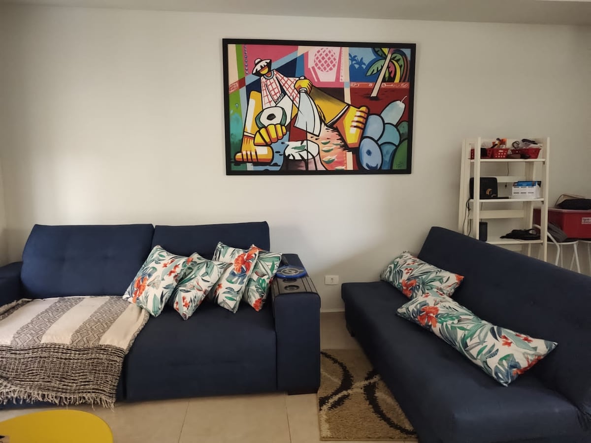 Sala de estar com sofá cama