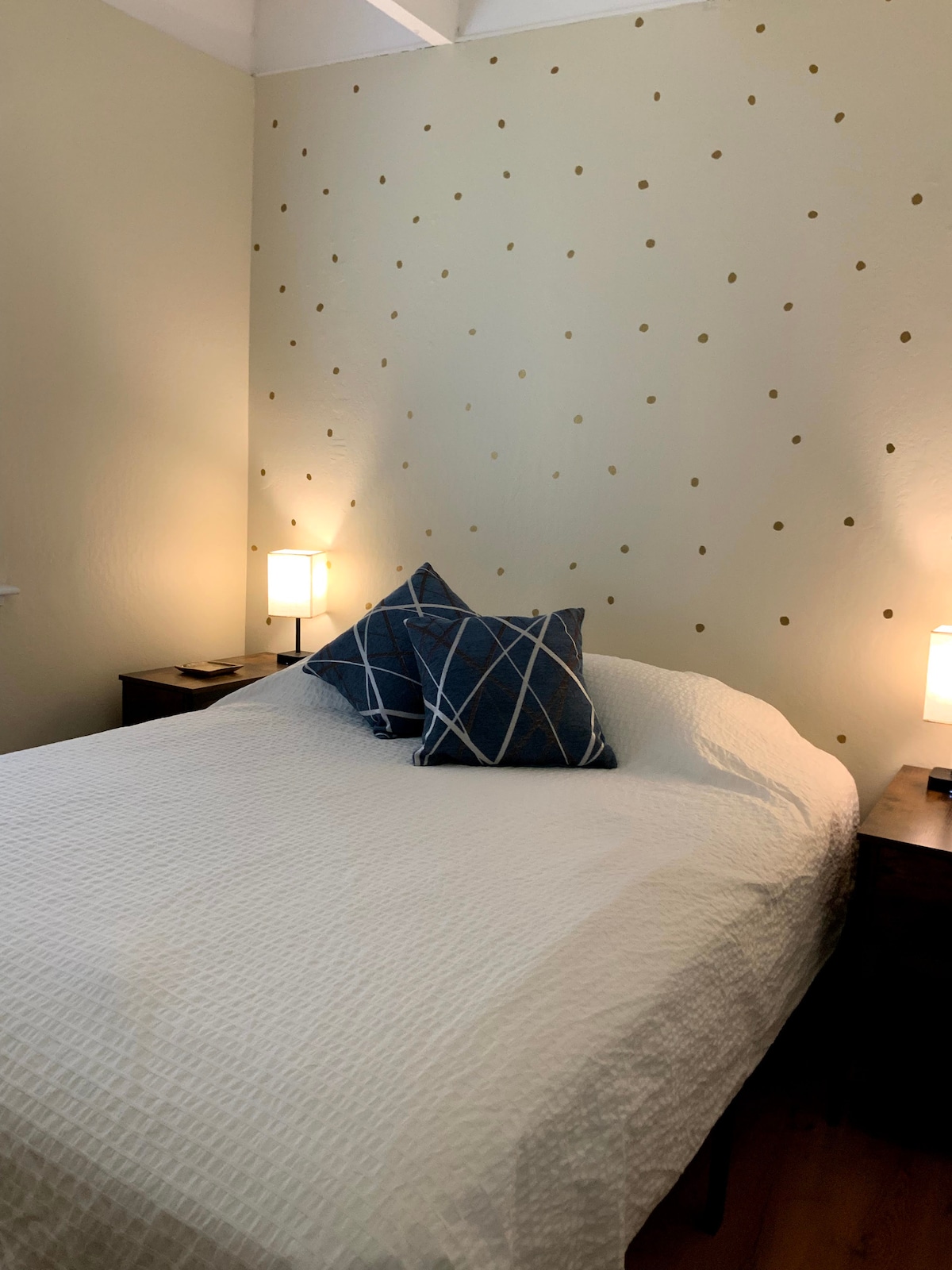 This bedroom is on the first floor and features a queen bed. 