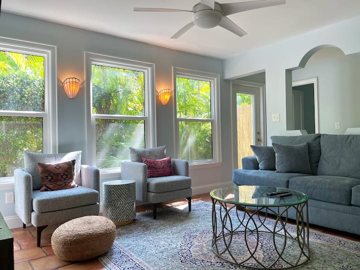 Family room with smart TV (YouTube TV provided for live TV, sports and news) and queen sofabed opens to kitchen and dining areas.