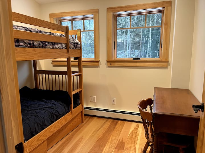 The kids will love the bunk beds with a dedicated space for your computer.
