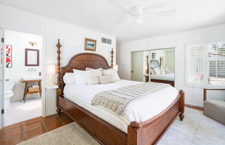 Primary bedroom with a king size bed. Lots of storage closet space and en suite bathroom