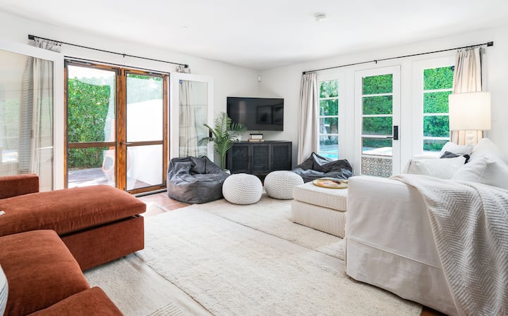 Entertainment room or fourth bedroom. Both the sofas open up to queen size sofa beds. French doors to our side yard and directly into pool area