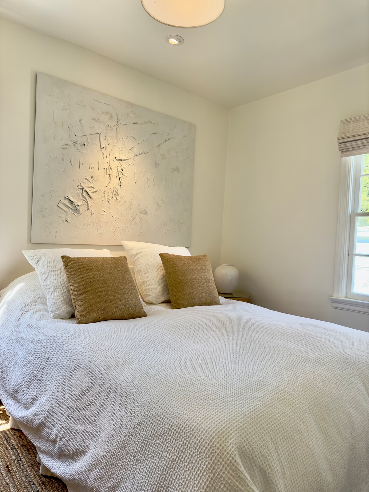 First floor bedroom with queen size bed and dresser for storage. 1st floor bedroom can use the front foyer closet for extra storage. 