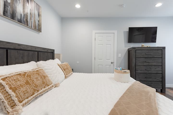 "Master bedroom with a king-sized bed . (King's Room) TV View"