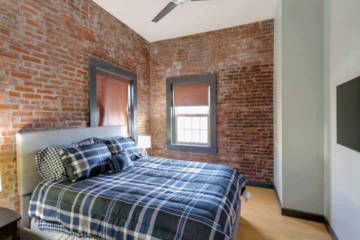 Secondary bedroom, located on the back of the home has a queen sized bed and smart tv. 