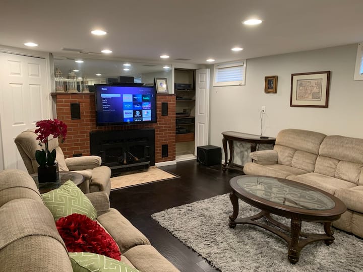 Finished Basement Sitting Area by Fireplace with Surround Sound System