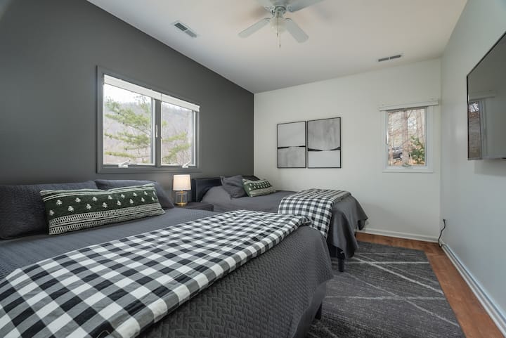 Bedroom 4-  Main level bedroom with 2 queen size beds and a Roku tv