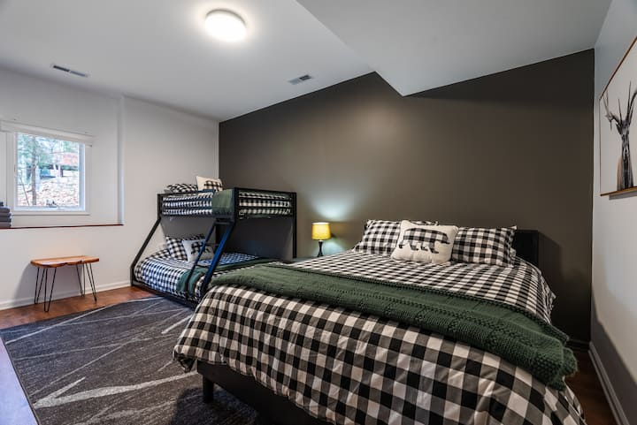 Bedroom 5-  main level bedroom with a queen bed, and a twin over full bunk bed.  There is also a rollaway bed in the closet.