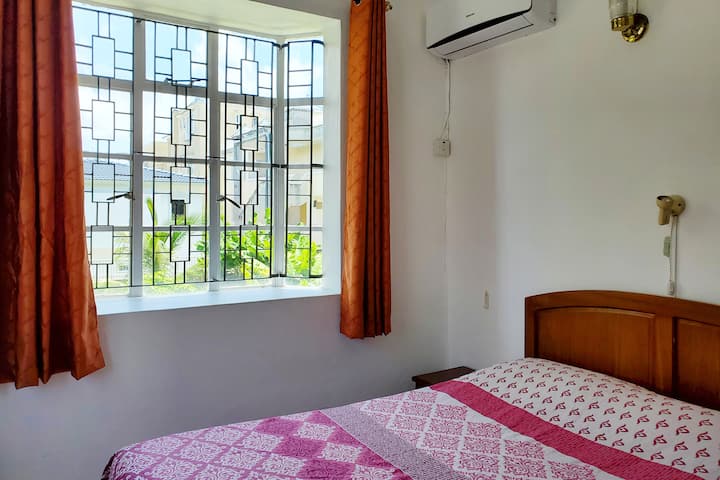 Spacious second bedroom, equipped with fan and air conditioning