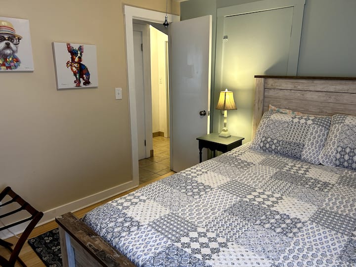 Queen bed located back of house