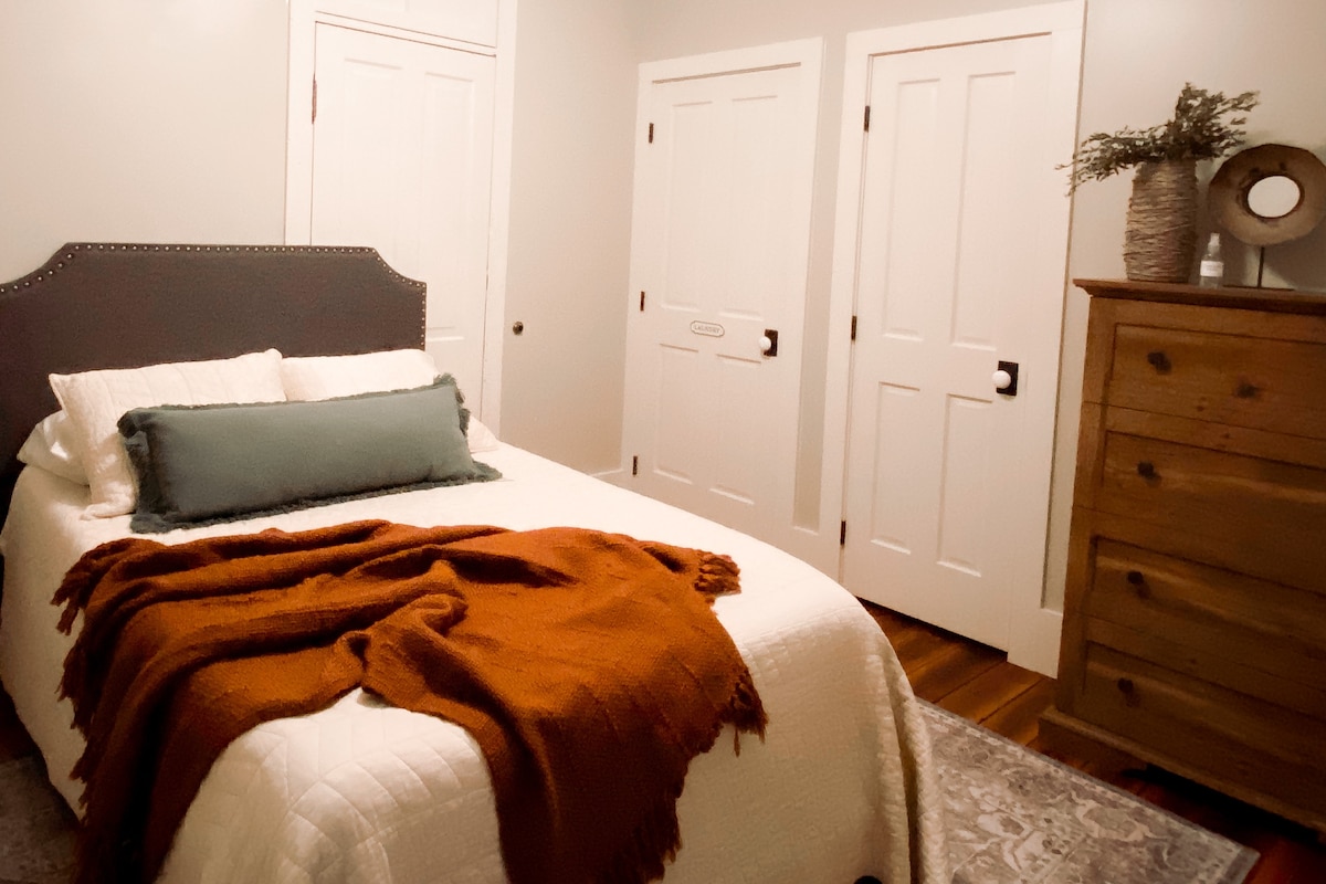 The second bedroom has a plush full-size bed, dresser, a clothing closet, and a closet with a washer and dryer unit. A full-size air mattress is also available in the loft to sleep additional guests if needed.