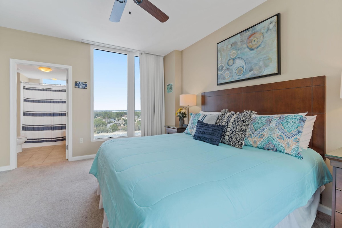 Spacious and beautifully decorated Master suite with Gulf and Lagoon pool views, patio access. 