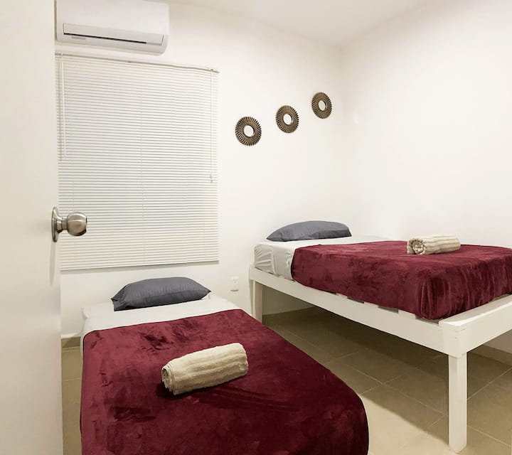 The third bedroom with two single beds and air conditioning

The third bedroom with two single beds and air conditioning