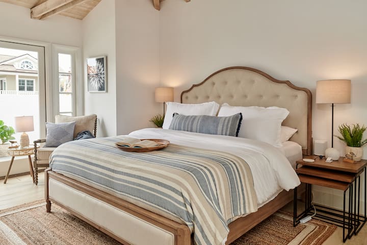 Upstairs Primary Bedroom with King Bed and Lounge Chair