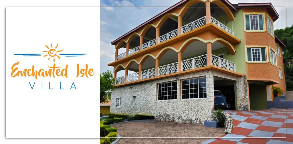 The villa exterior is characterized by a blend of colorful stucco and stone, featuring arched balconies on the upper level. A well-maintained driveway leads up to the entrance, surrounded by manicured gardens and decorative pathway tiles.