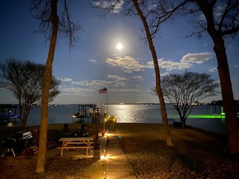 Open water view: cozy hot tub & fire pit with dock