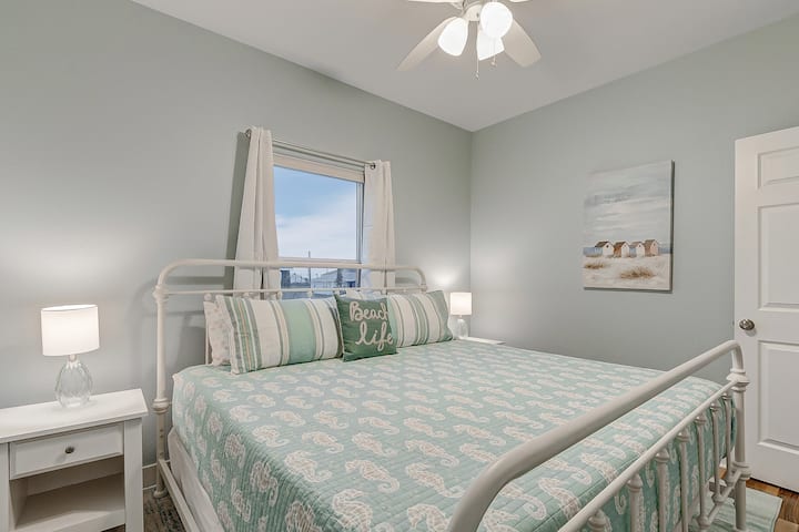 The second bedroom features a king size bed, 42" Roku TV, and closet. Window includes blackout curtains.