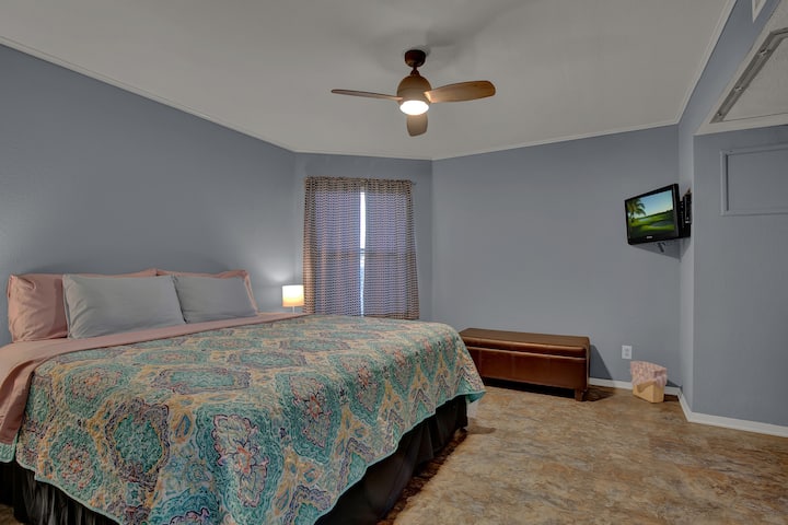 both bedrooms offer a fully dressed king bed, ceiling fan, and cable tv