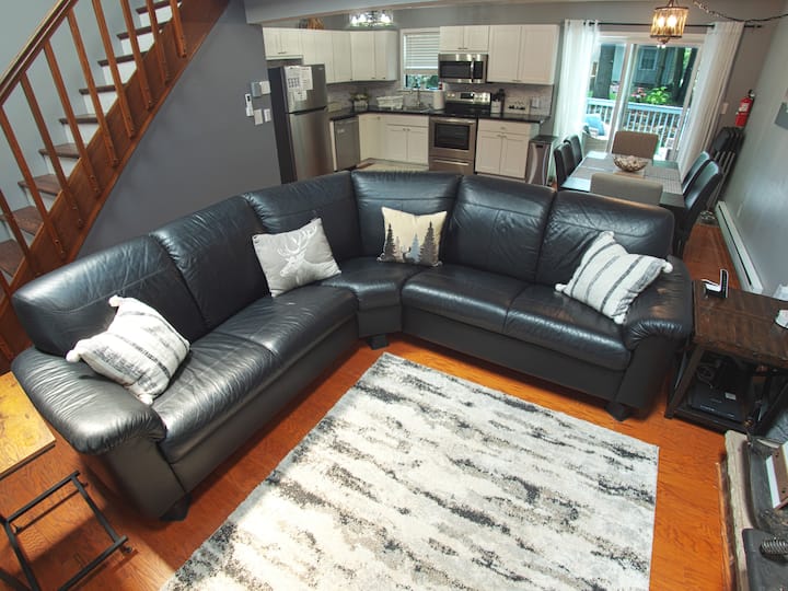 Spacious Living Room: Relax on our plush leather sectional while watching your favorite shows on the 65-inch 4K Roku TV.