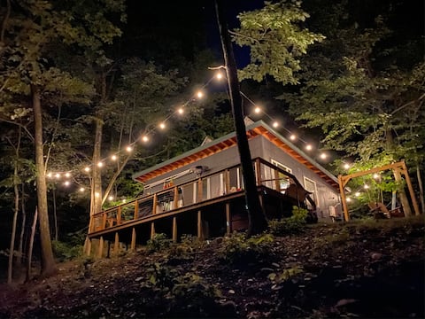 Secluded luxury: modern riverfront fishing cabin