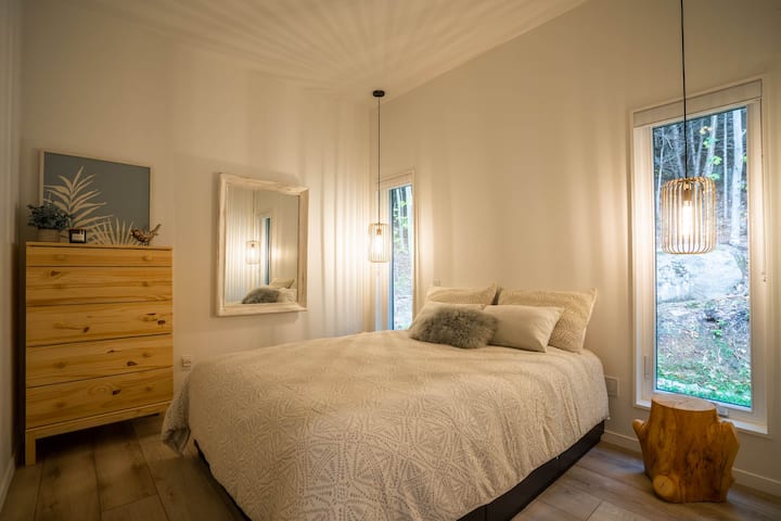 Bedroom 2 with super comfortable queen bed with nature view.