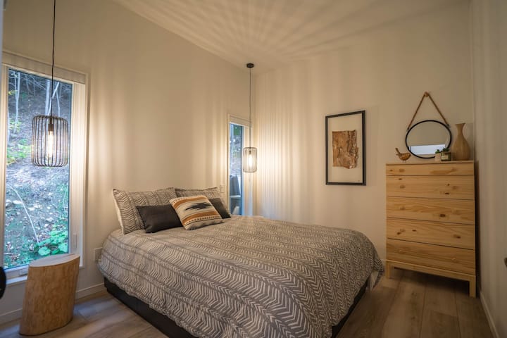 Bedroom 1 with super comfortable queen bed, nature view.