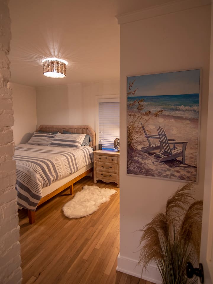Relaxing beach vibes start to soothe your soul as you walk into the main floor bedroom.