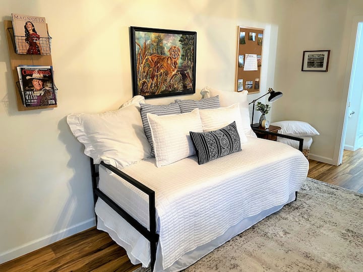 The main level guest bedroom has a trundle bed with 2 twin mattresses (singles).