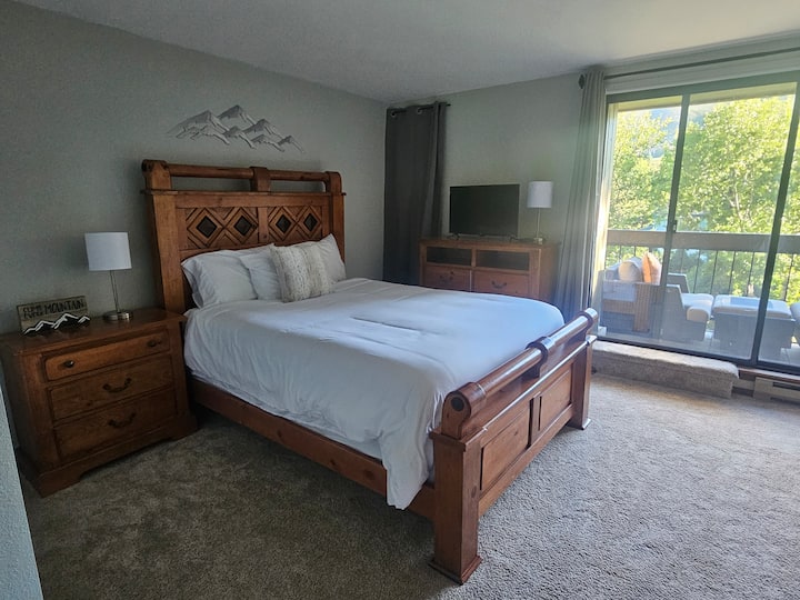 Huge master bedroom with 2nd story porch overlooking the Eagle River. This room also has a futon sleeper and air mattress under the bed, if needed.
