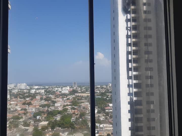 Ventana de alcoba medium beautiful view  around and with sea view to be able to enjoy a cafe, in private apartment overlooking Playa Marbella, Cartagena de Indias.