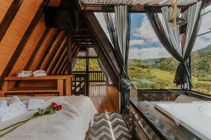 Bedroom with 2 box beds. Smart TV with Netflix and cable TV in the main bed, shower and whirlpool with mountain views.