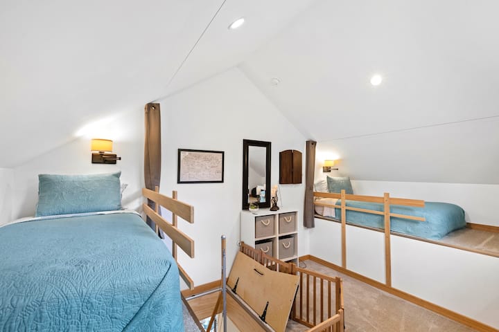 The 3rd floor loft room has two twin beds, and a electronic dart board. This room is not for children!