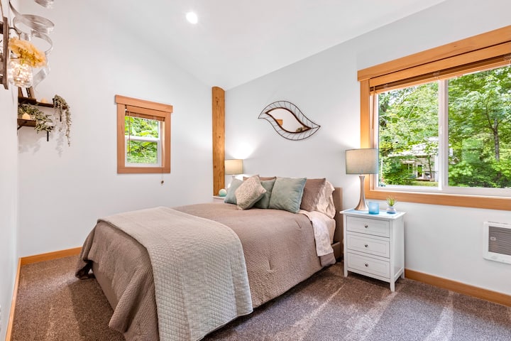The 1st floor queen bedroom is a private bedroom located off of the bonus room  that has the trundle beds.