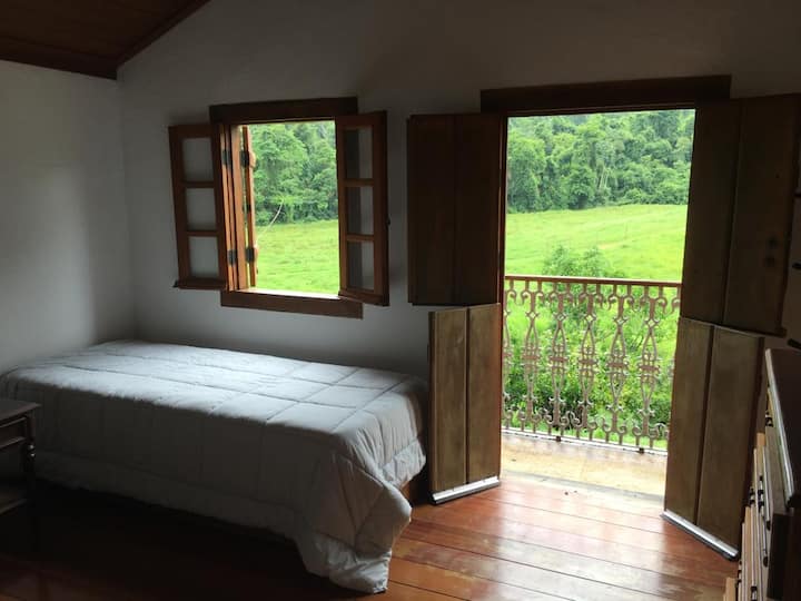 Втори етаж. Две легла, килер, прозорец и балкон с изглед към градината и гората.