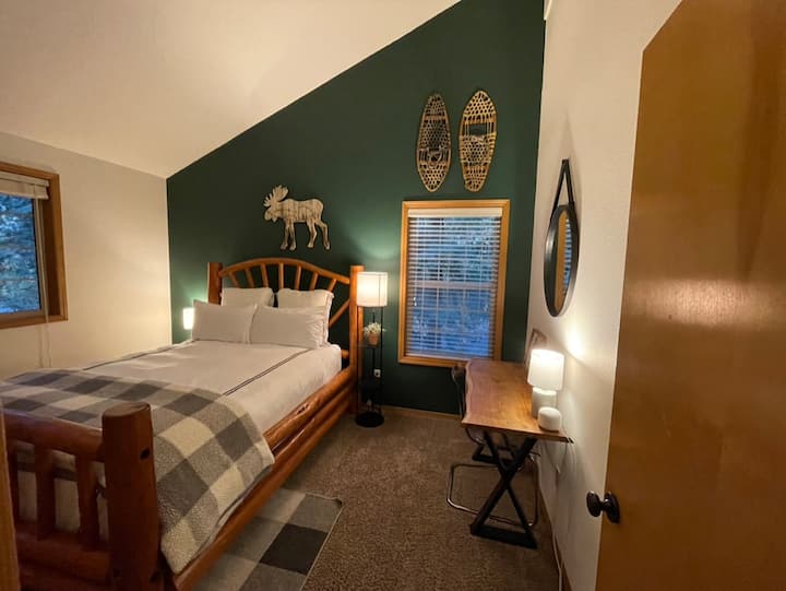 Newly added Queen log bed frame with premium bedding.  Bedroom on 2nd floor. 
Spacious closet + dresser.
Dedicated workspace with live edge desk top. 