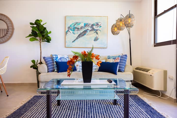 Comfortable lounge area with bean bags and beach boho themed decor. 