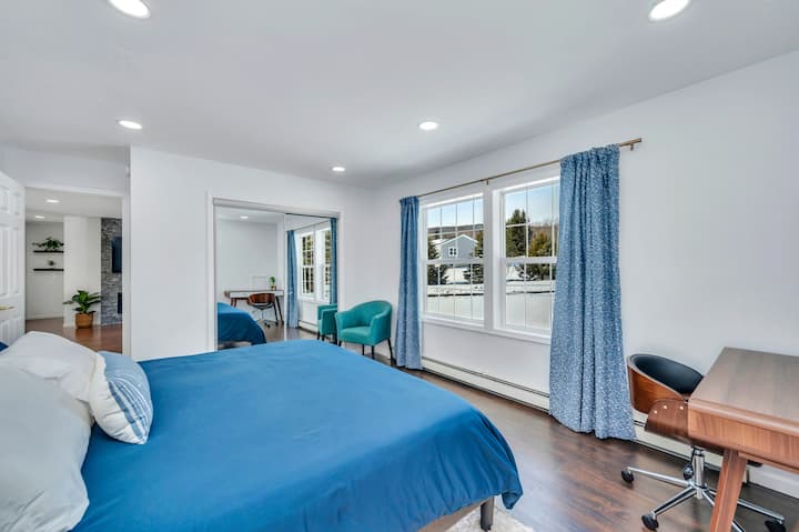 Spacious master bedroom w/ king-size  bed, closet, desk and ensuite