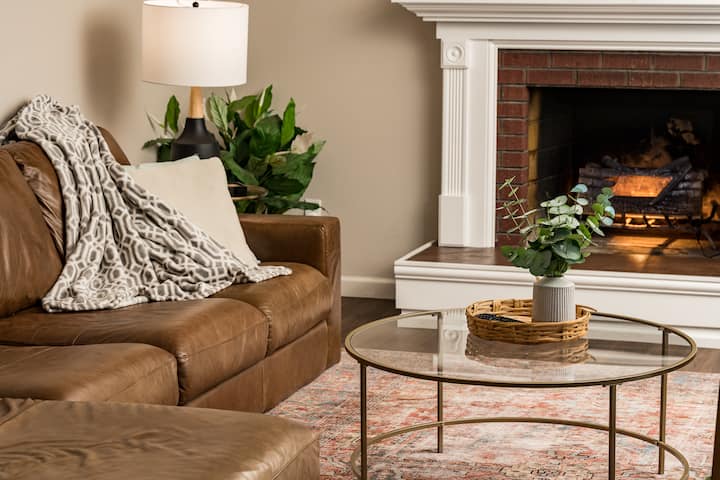 Cozy living room with electric fireplace, comfy couch, Apple TV to watch your favorite shows/movies.
