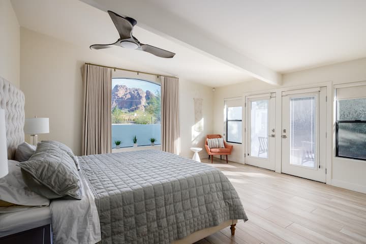 Master bedroom with king bed, private patio, and Camelback Mountain view