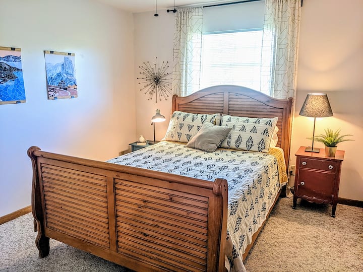 Guest bedroom with queen bed, spacious closet and dresser. 